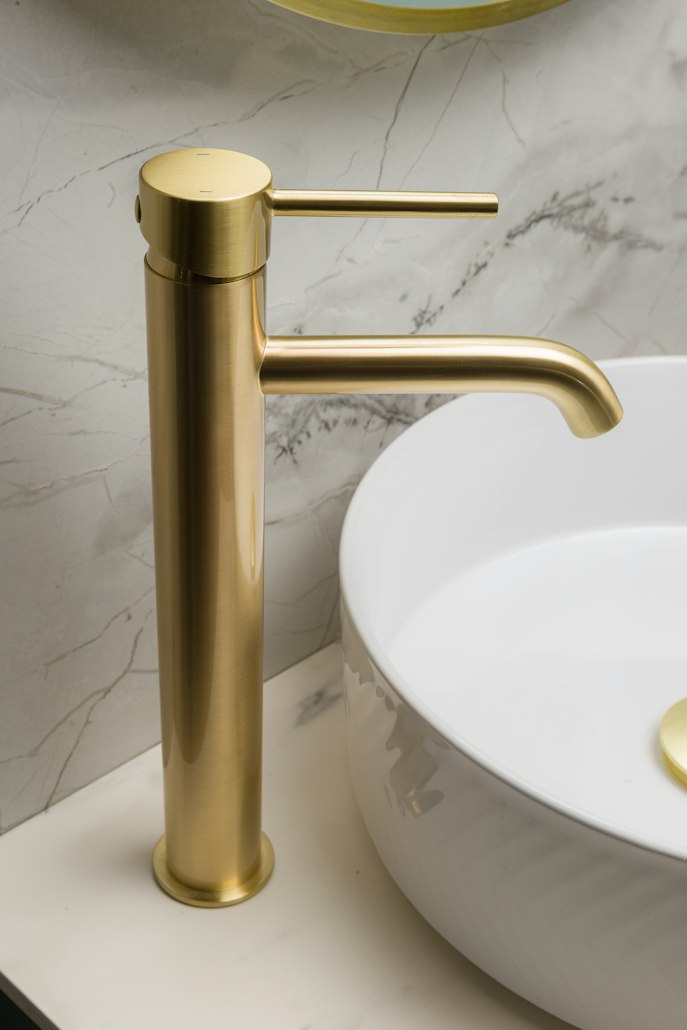Gold faucet at a bathroom sink
