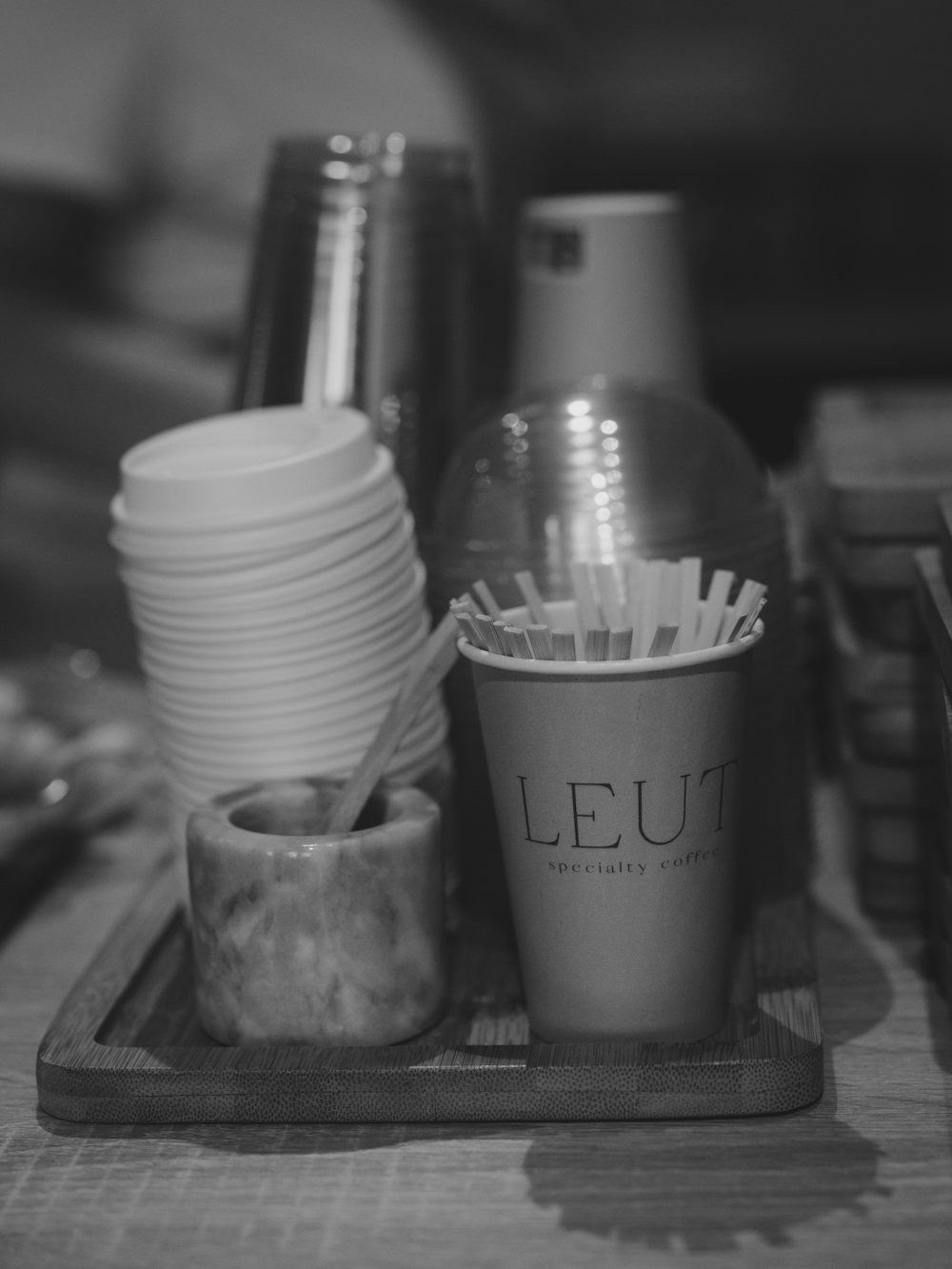 Paper cups and stirrers at a coffee station
