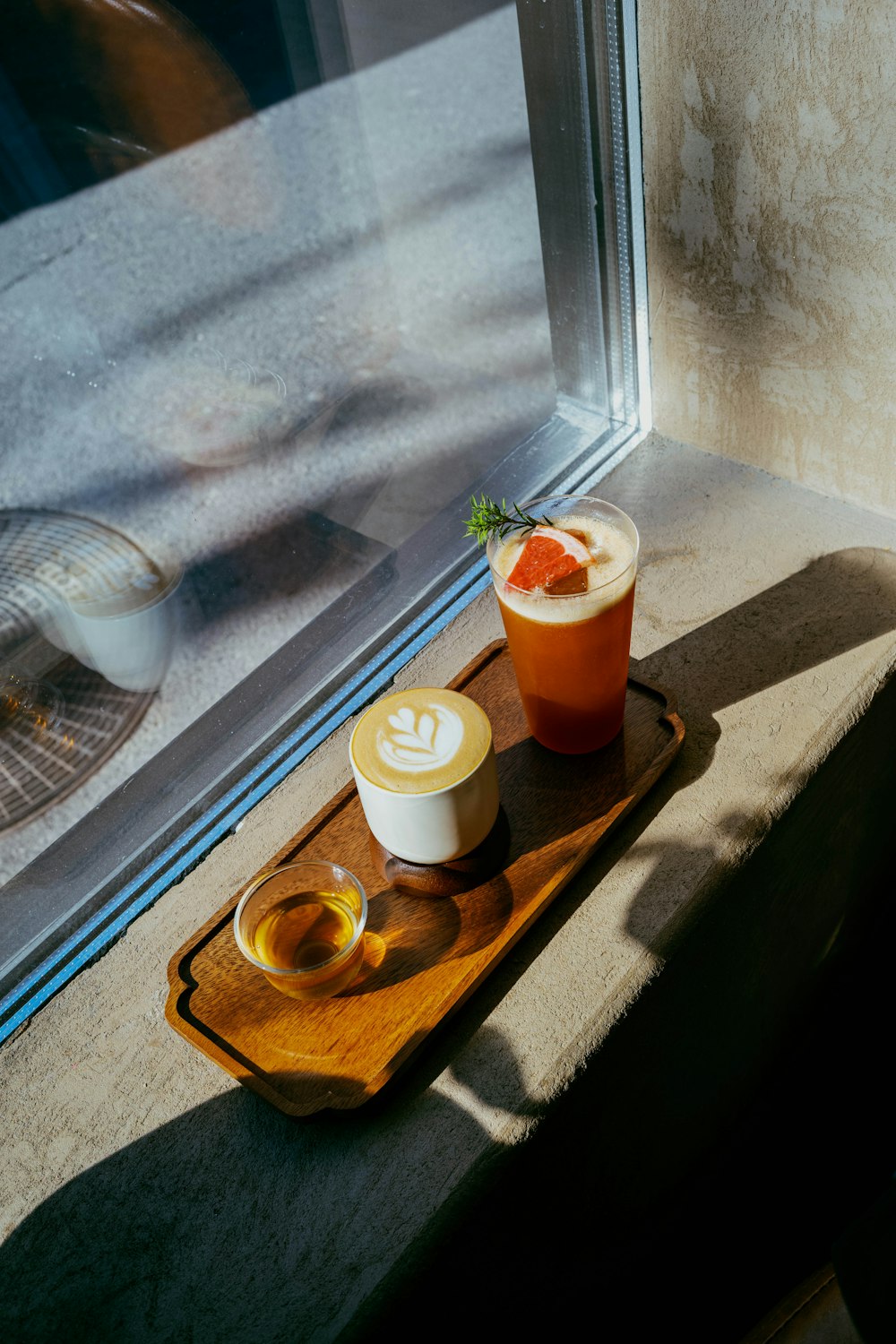 Coffee, tea and a chilled drink on a tray